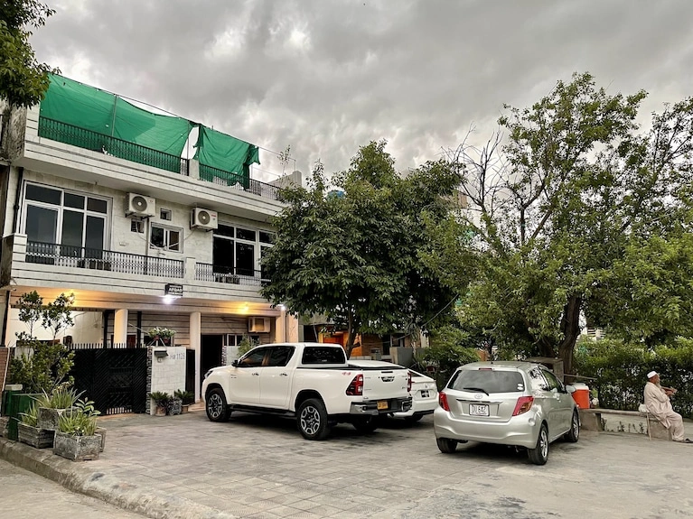 Modern guest house in Islamabad with parking, greenery, and spacious exterior – ideal accommodation for travelers in 2026.